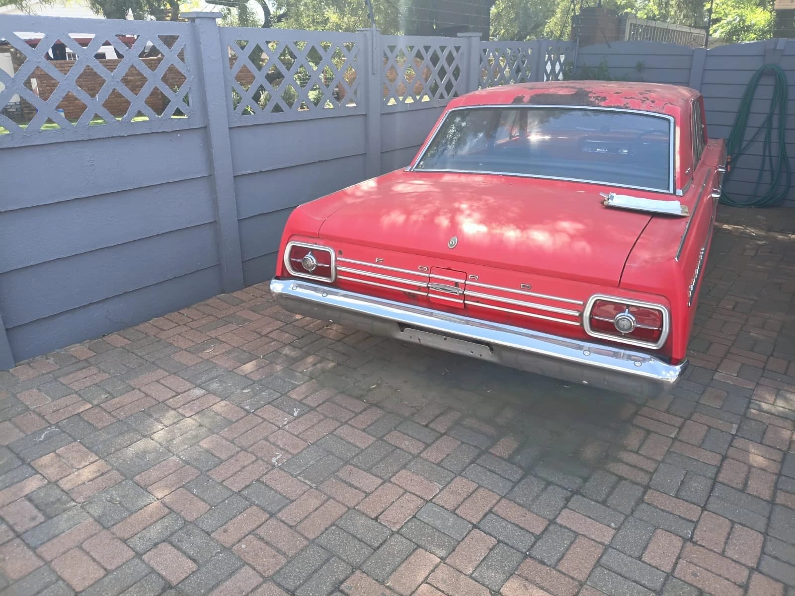 The rear view records the boot, tail lamps, badging and chrome bumper at this stage of the project.