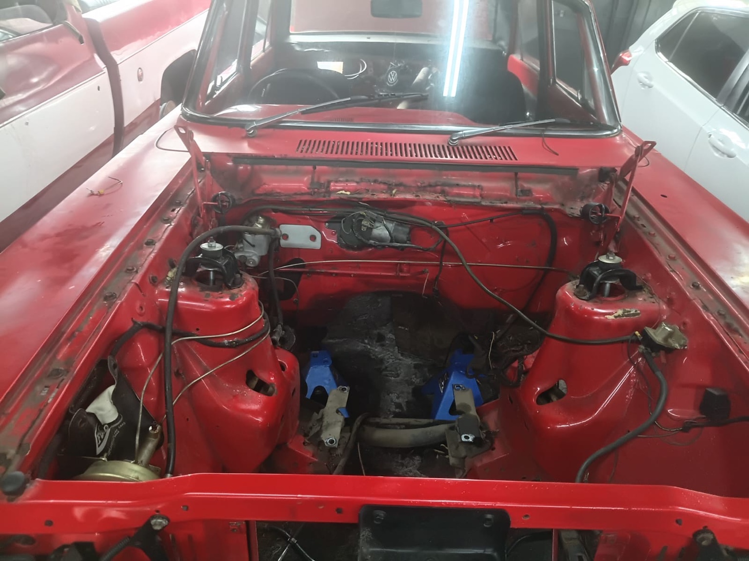 Engine bay with the engine removed for rebuild work.